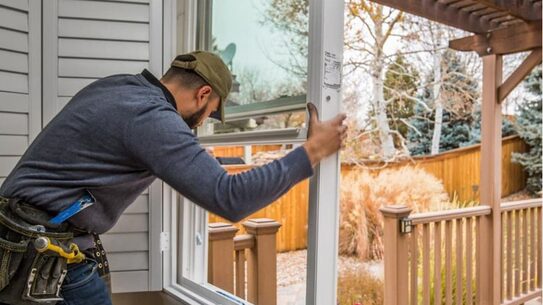 Local window contractor checking the fit of a new casement window