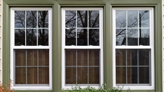 Newly installed double-hung windows on a home exterior