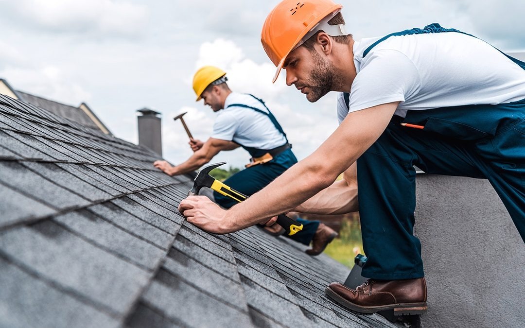 Professional roofing contractors at work